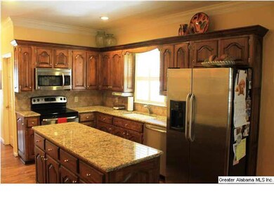 The Kitchen has stainless appliances and an island