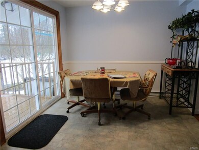 Bright eating area with new light fixture. Sliding