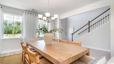 Dining room with hardwood / wood-style flooring an