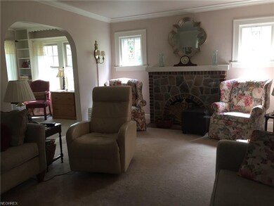 Living room with stone fireplace