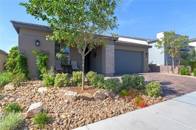 View of front of property with stucco siding, driv