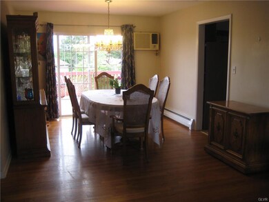 View of dining room and doorway to eat-in kitchen.