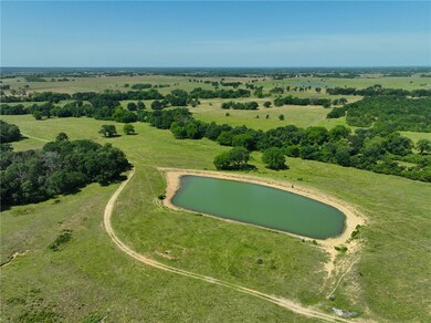 Aerial view of property and surrounding area with