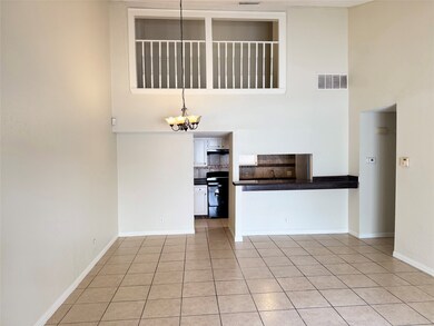 The living and dining area is enhanced by soaring