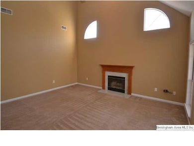 Living Room with wood burning fireplace.