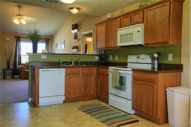 Roomy kitchen has plenty of counter and cabinet space.  Smooth top stove of course remains.  Fridge is negotiable as is washer and dryer.  