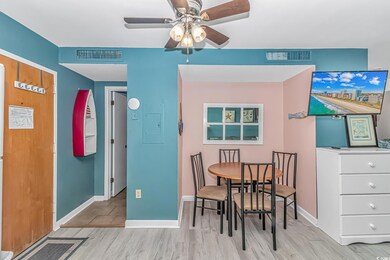 Dining area with ceiling fan, light wood finished floors, and baseboards