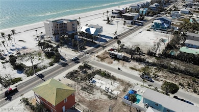 Drone / aerial view featuring a beach view and a w