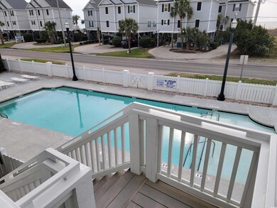 Community pool with a residential view and a fence
