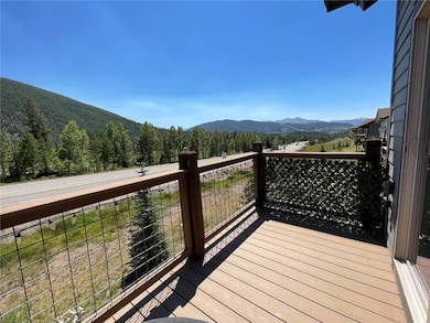 Wooden deck featuring a mountain view