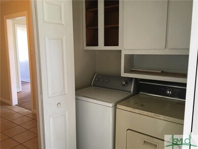 Washer and dryer in closet in kitchen