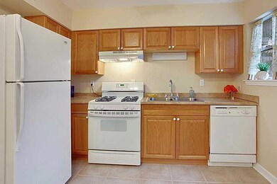 Kitchen. Door on right leads to fenced patio.