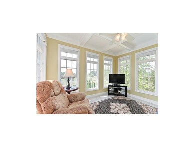 Bright Sunroom overlooking acreage.