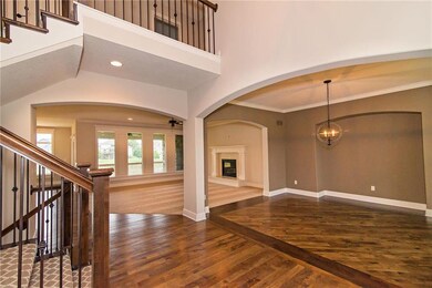 Enter to the 2-story foyer and notice the gorgeous