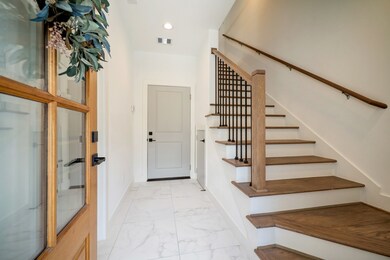 Inviting entry with tile floor.