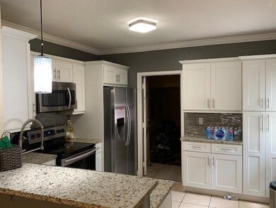 7679 Tamarac Island Cir, Tamarac, FL 33321 - photo 2