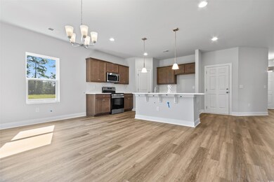 Kitchen featuring light wood-type flooring, a nota