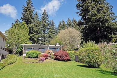 Front of home with the lake behind.