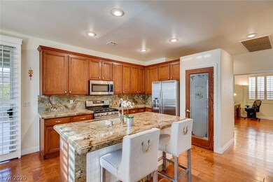 Granite counters, spacious island. The pantry door