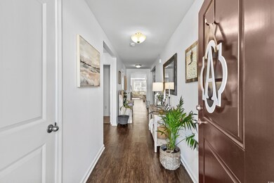Corridor featuring dark hardwood / wood-style floo
