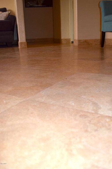 Travertine flooring with baseboards thou
