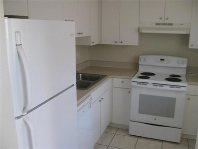 KITCHEN WITH PASS-THRU TO LIVING ROOM - DINING ROOM AREA.  