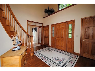 Large front entry hall with wood flooring and two 