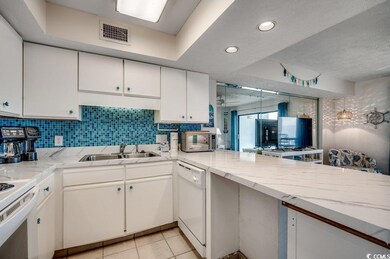 Kitchen featuring light tile patterned flooring, a