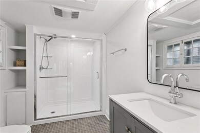 Bedroom off of the living room looking toward en suite bathroom.