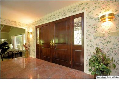 Foyer is bright with double doors and marble floor