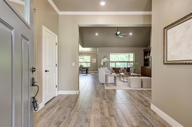 Entryway featuring light wood-style floors, a ceil