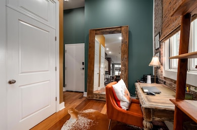 Office space featuring healthy amount of natural light and wood finished floors