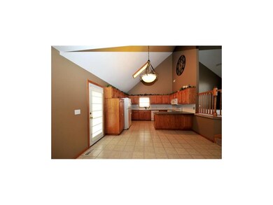 The kitchen is on the same level as the garage for