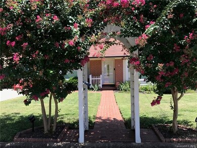 Lovely arbor entrance to this home.