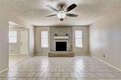 Large living space with beautiful fireplace and lo