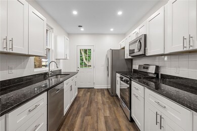 Beautiful kitchen with granite counters, stainless