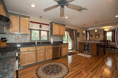 Just look at these floors! The copious cabinet space! The sliders to the HUGE outdoor entertainment area! This is AMAZING!