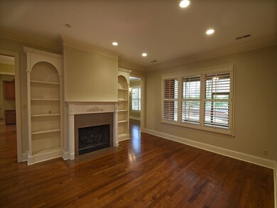 The open flow of the entry leads to a cozy living 