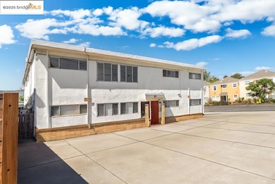 Rear view of house featuring stucco siding