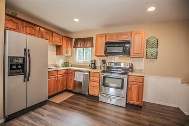 Nicely Updated with Solid Oak Cabinetry and Stainl