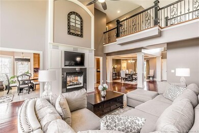 Stunning living room open to double sided fireplac