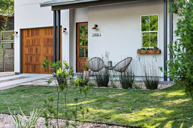 Doorway to property with stucco siding and a yard