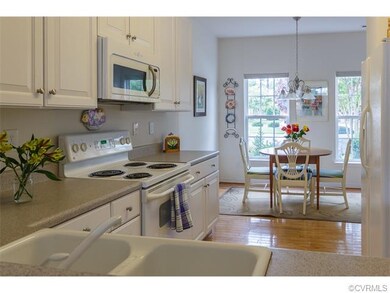This bright kitchen and breakfast nook offers a re