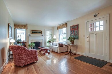 Living Room with wood burning Fireplace and access to Porch.