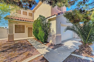 View of front of house with a tiled roof, stucco s
