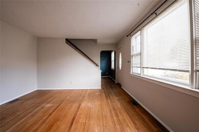 1st floor living room bathed in sunlight