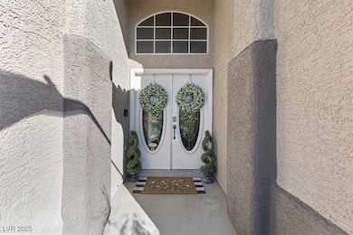 Doorway to property with french doors and stucco s