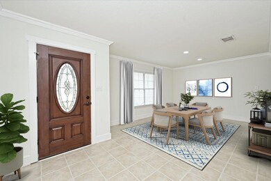 Entrance foyer with light tile patterned floors, 