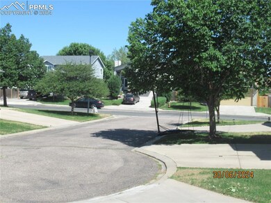 Entrance to property with a lawn