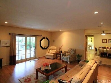 Family room with view of breakfast nook in kitchen